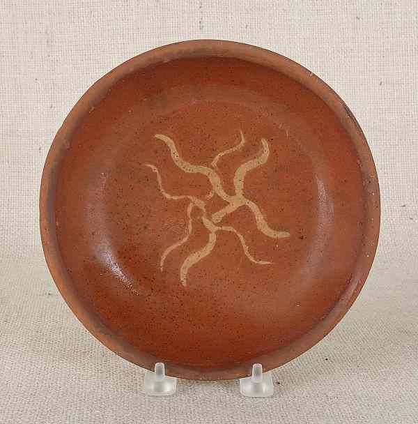 Appraisal: Pennsylvania redware shallow bowl th c with yellow slip X