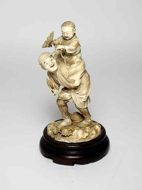 Appraisal: A Japanese carved ivory Okimono Meiji period depicting a man