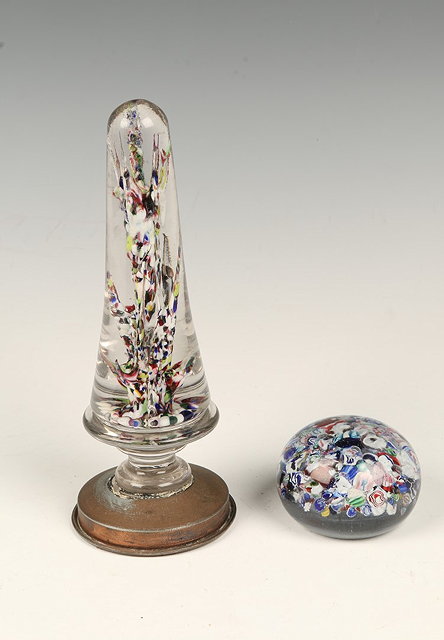 Appraisal: A MILLEFIORI GLASS WIG STAND standing on a bronzed turned