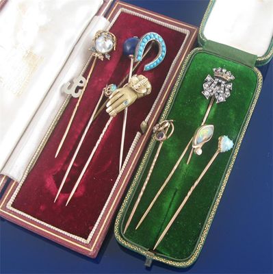 Appraisal: A Royal cipher stick pin the letters AW set with