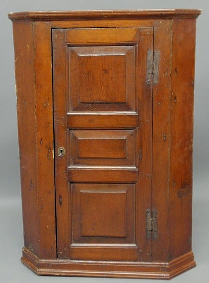 Appraisal: Pennsylvania pine corner cupboard th c with a raised panel