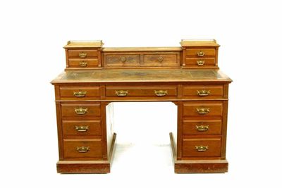 Appraisal: A late Victorian walnut pedestal desk by Maple Co the