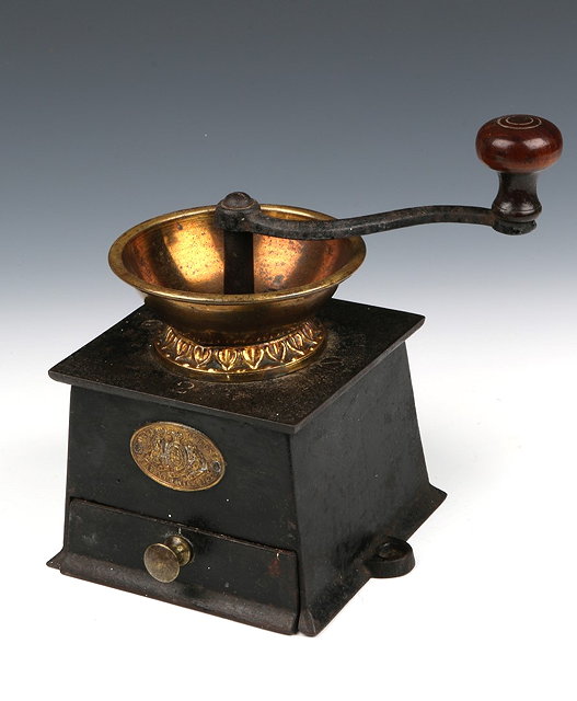 Appraisal: A VICTORIAN COFFEE GRINDER by A Kenrick Sons with coat