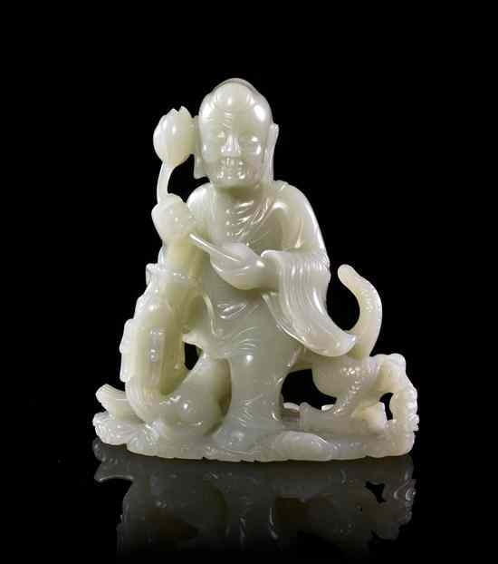 Appraisal: A Carved Jade Luohan of white colored stone depicting the