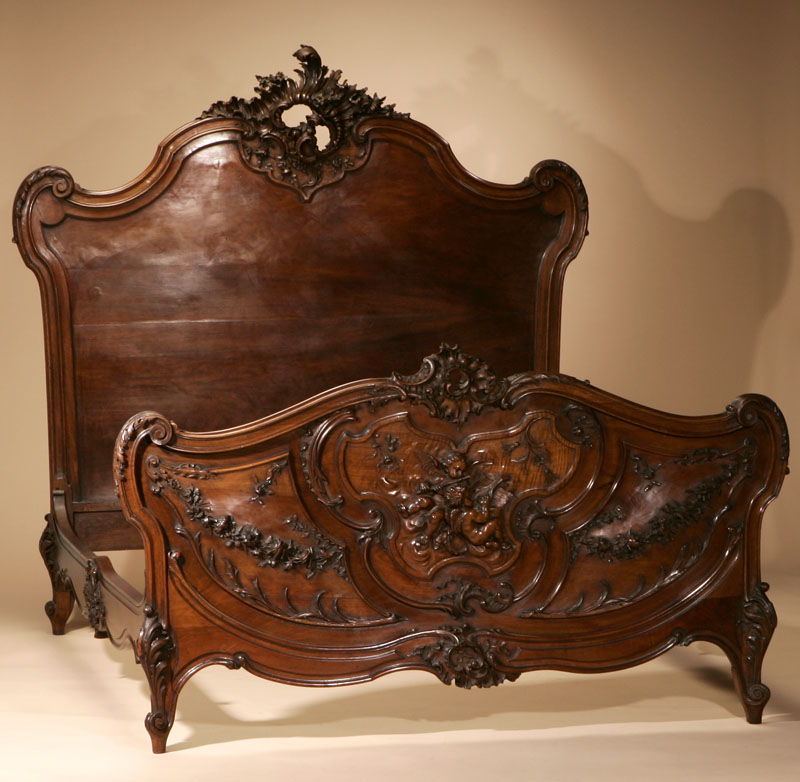 Appraisal: A Louis XV style walnut bed A Louis XV style