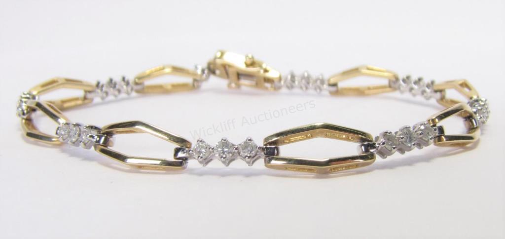 Appraisal: A K yellow gold diamond link bracelet composed of three-diamond