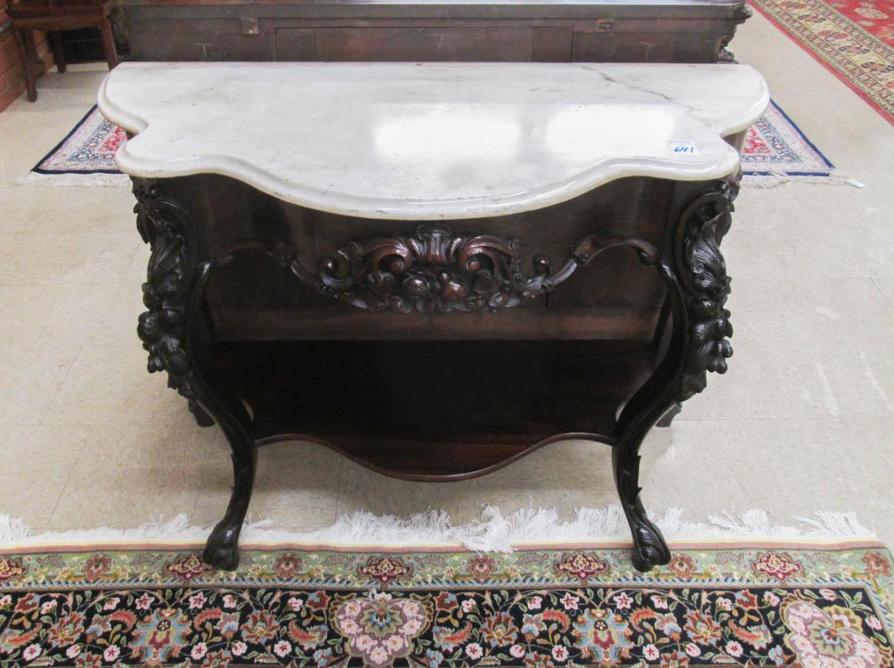 Appraisal: A VICTORIAN MARBLE-TOP CARVED ROSEWOOD CONSOLE TABLE Continental th century