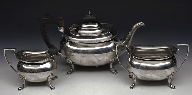 Appraisal: A SILVER THREE PIECE TEA SERVICE of rounded form with