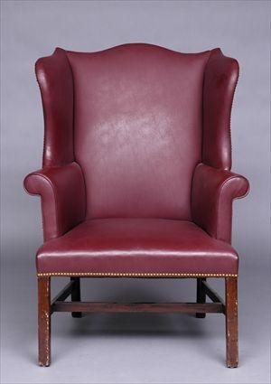 Appraisal: GEORGE III LEATHER UPHOLSTERED ARMCHAIR The serpentine cresting rail above