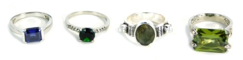 Appraisal: Four dress rings comprising a CZ M S green stone