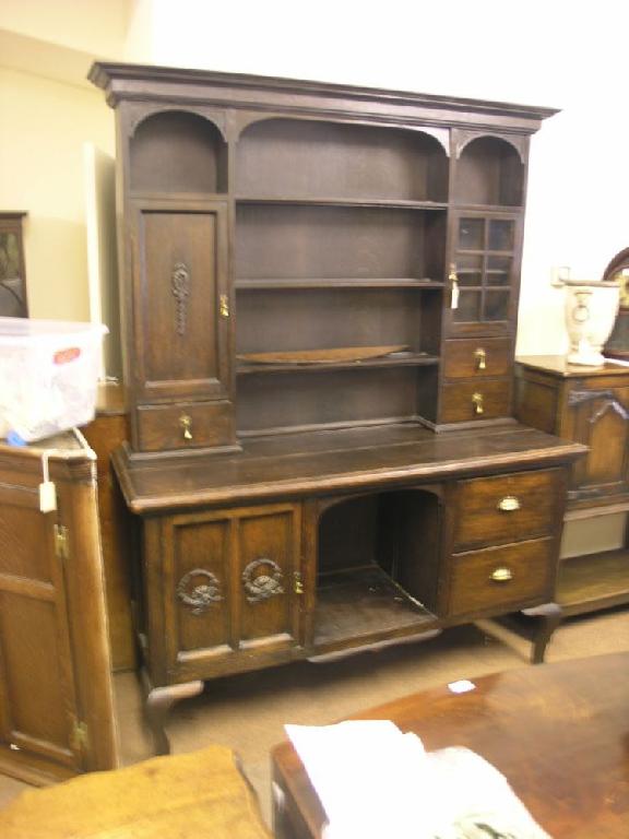 Appraisal: An early th century solid dark oak dresser plate rack