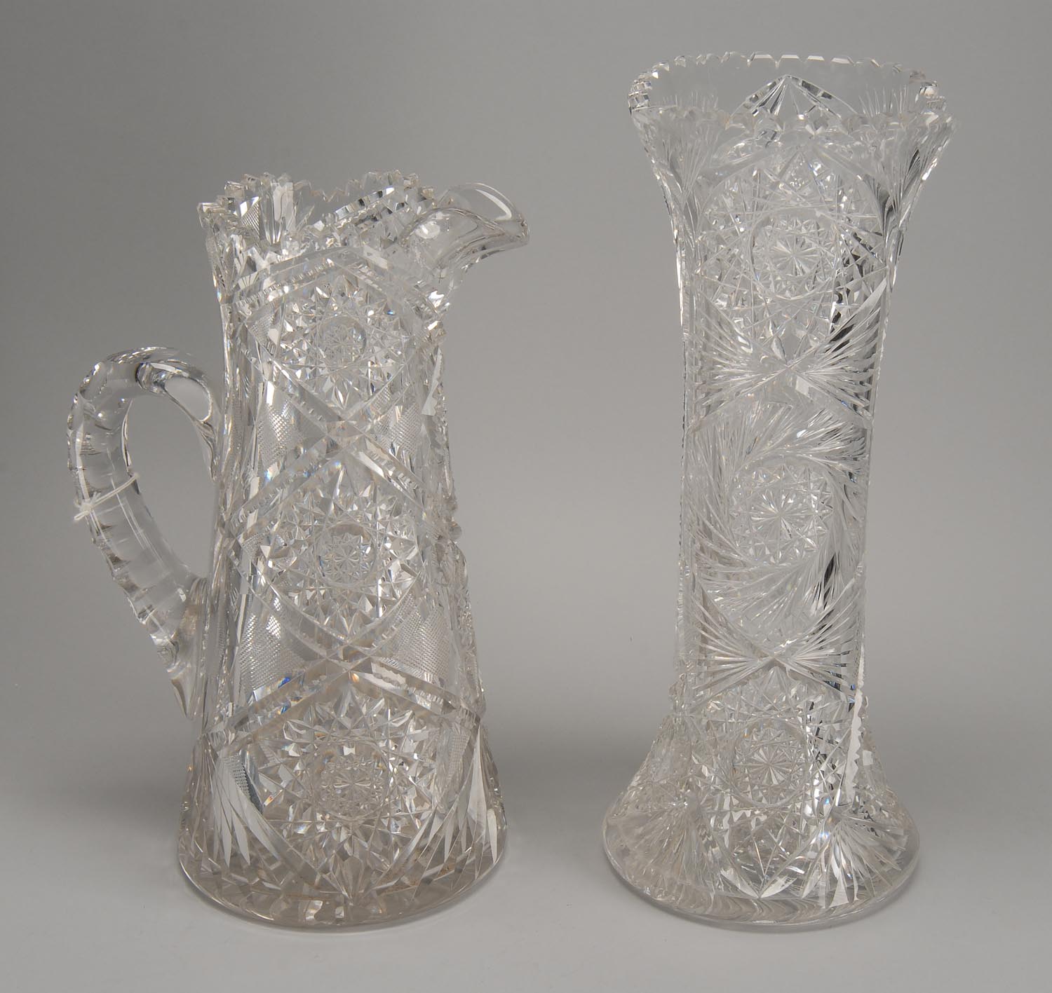 Appraisal: CUT GLASS VASE AND PITCHER th CenturyIn hobstar and crosshatch