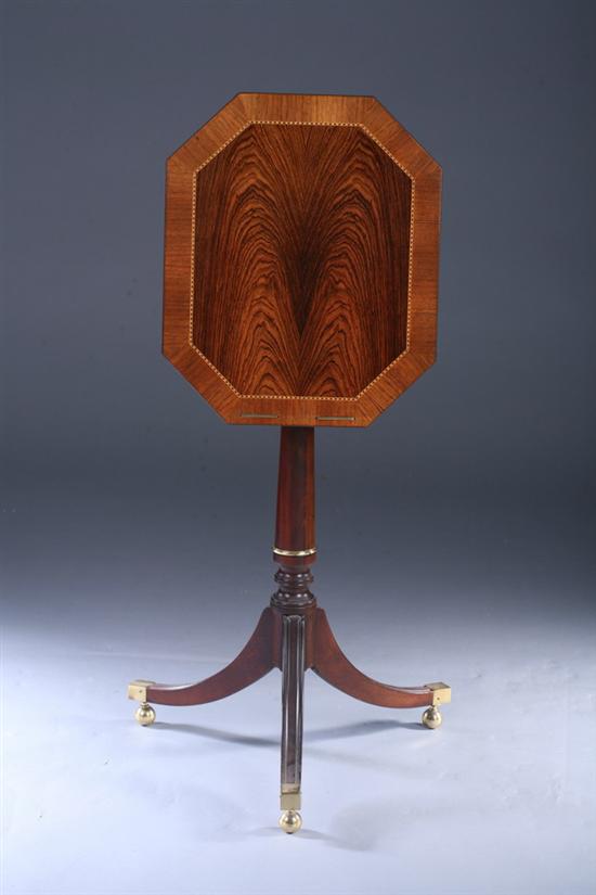 Appraisal: REGENCY STYLE INLAID MAHOGANY OCTAGONAL-PEDESTAL TRI-POD TABLE th century with