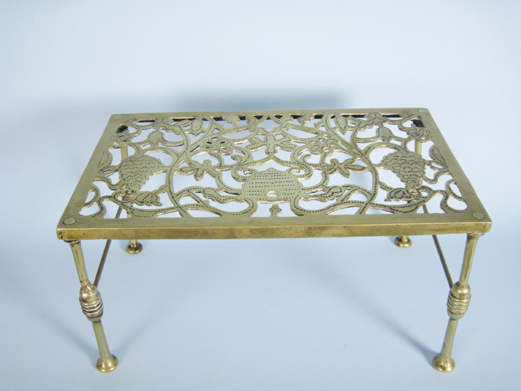 Appraisal: A Georgian brass rectangular Kettle Stand with pierced top having