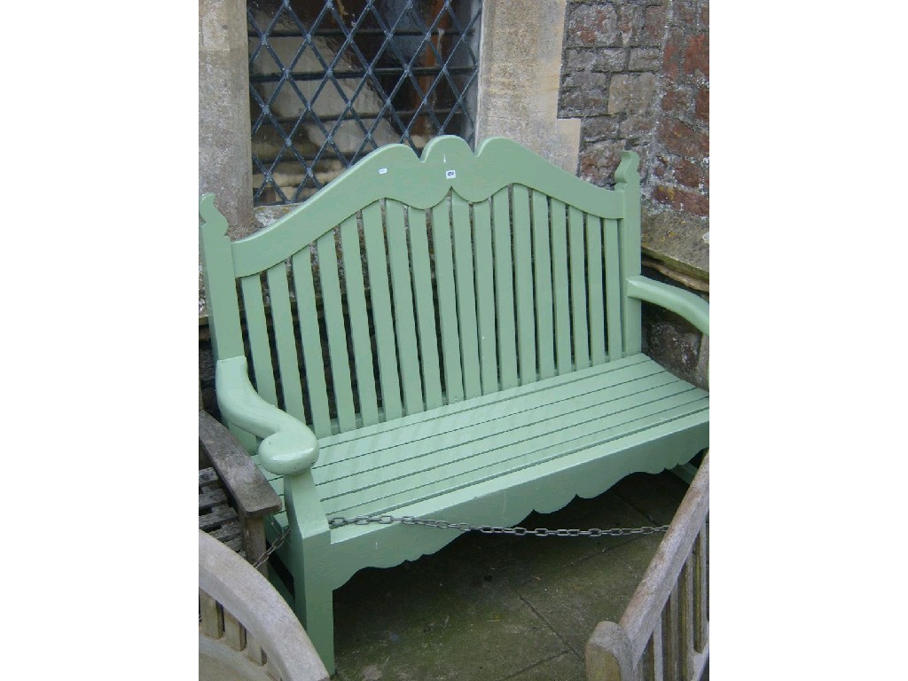 Appraisal: A painted hardwood garden bench with shaped arms and square