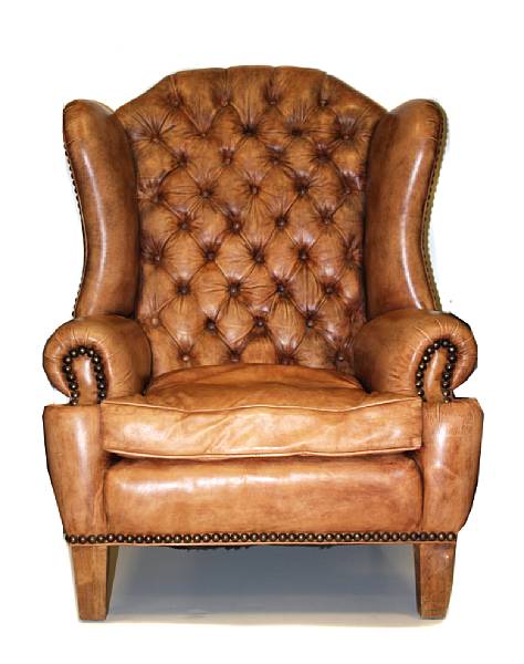 Appraisal: A pair of George III style oversized leather upholstered wingback