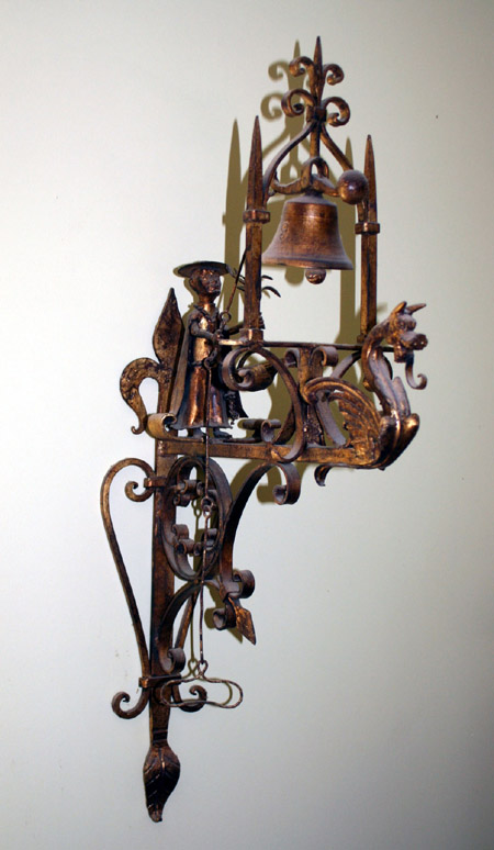 Appraisal: Gilt Wrought Iron Wall-Mounted Figural Bell th Century Height in