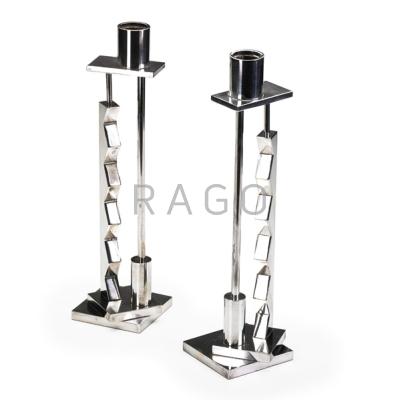 Appraisal: ETTORE SOTTSASS SWID POWELL Pair of weighted candlesticks Italy s