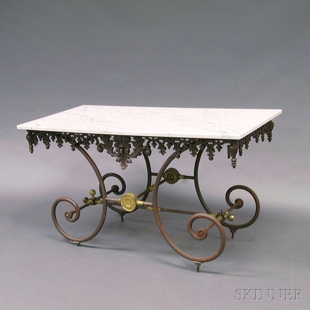 Appraisal: Cast Metal and Brass Marble-top Table th century the rectangular