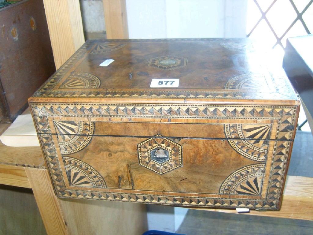 Appraisal: A Victorian burr walnut straw marquetry sewing box the interior