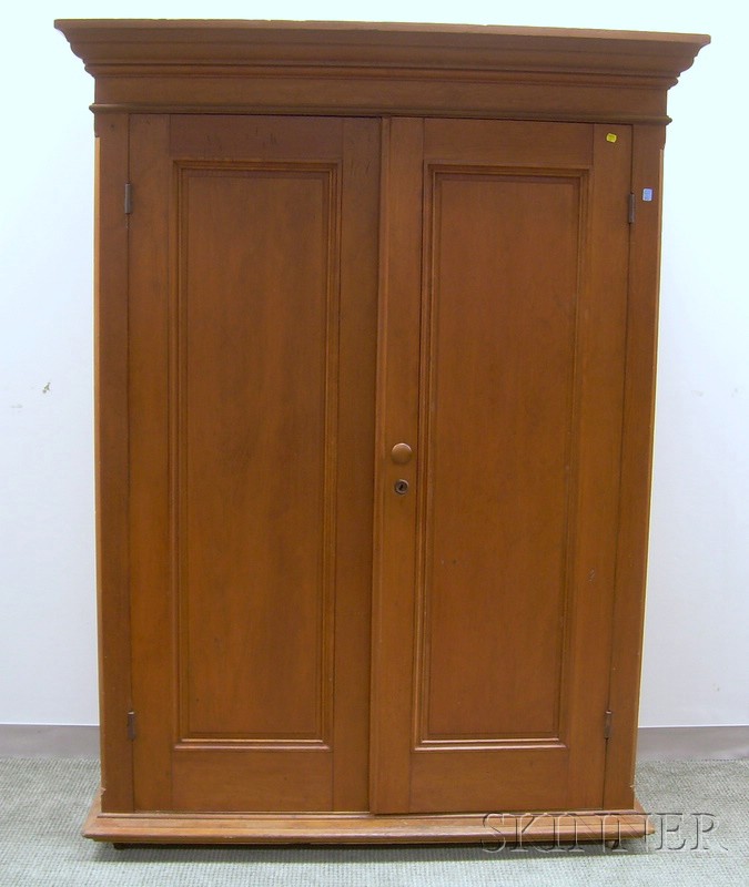 Appraisal: Cherry Two-Door Wardrobe Cabinet the interior with two adjustable shelves