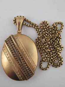 Appraisal: A silver gilt locket approx cm on a yellow metal