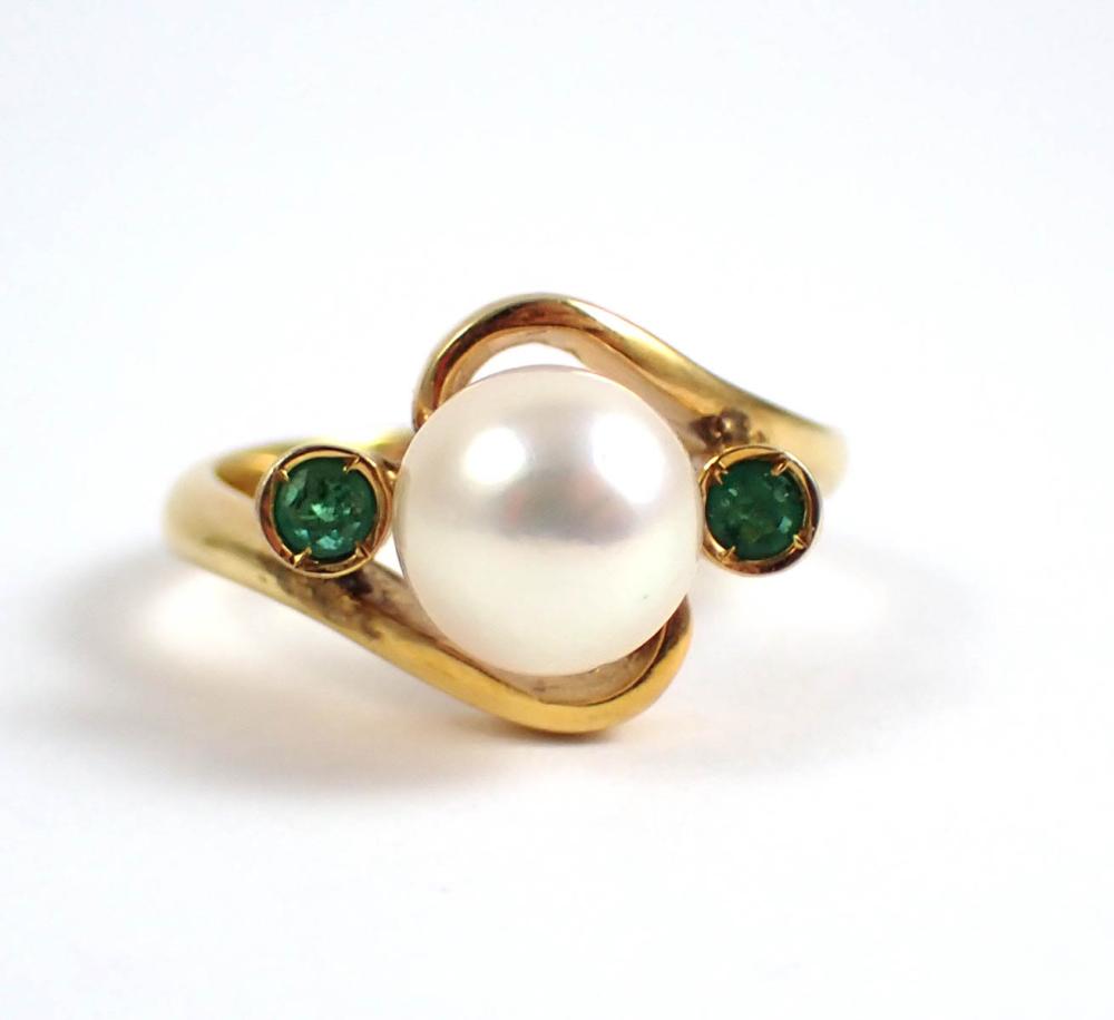 Appraisal: PEARL EMERALD AND FOURTEEN KARAT GOLD RING bezel set with