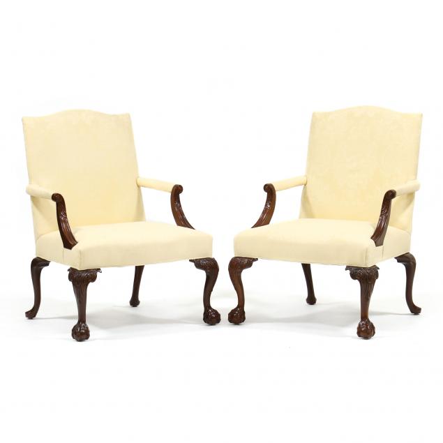 Appraisal: SOUTHWOOD PAIR OF CHIPPENDALE STYLE UPHOLSTERED LOLLING CHAIRS Late th