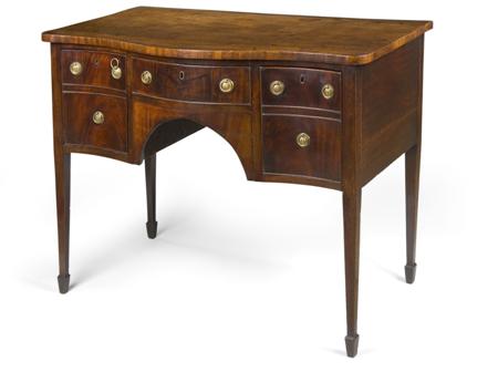 Appraisal: A George III mahogany sideboard late th century serpentine fronted