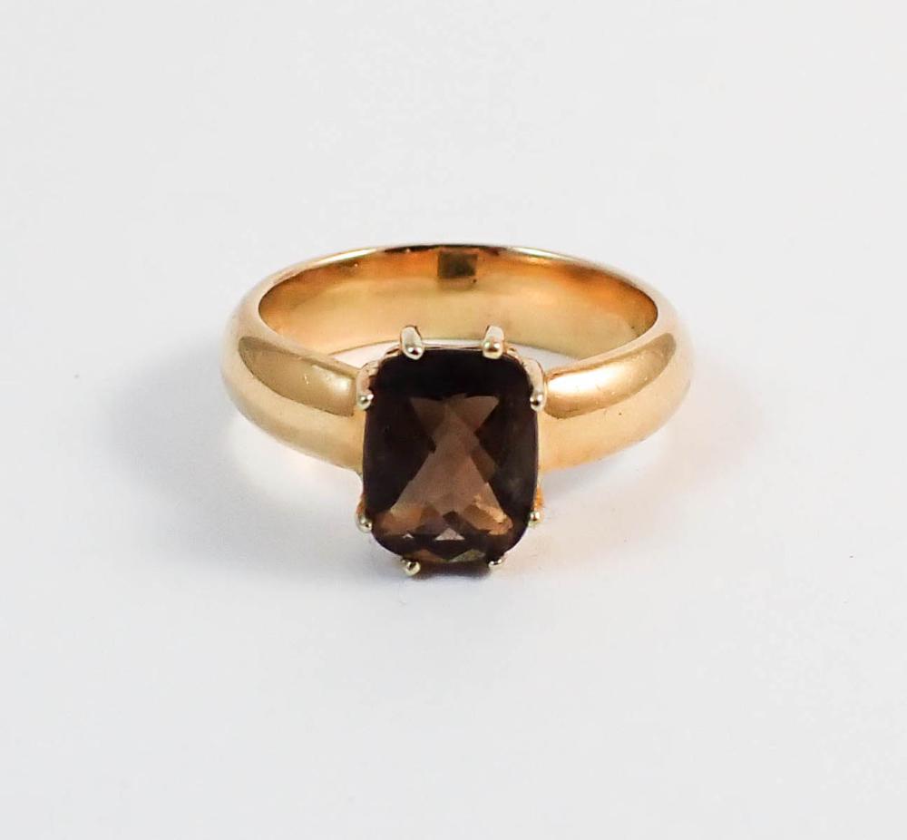 Appraisal: SMOKY QUARTZ AND FOURTEEN KARAT GOLD SOLITAIRE RING with eight