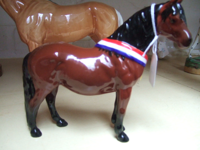 Appraisal: A Beswick horse Warlords mare and another Beswick horse another