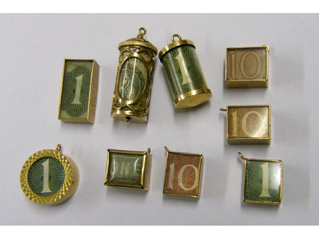 Appraisal: Nine assorted ct note charms containing ten shilling and one