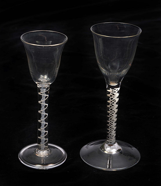 Appraisal: TWO CORDIAL GLASSES with shaped bowls opaque twist stems and