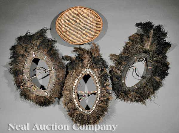 Appraisal: Three Kikuyu Hide and Feather Headdresses Kenya each oval hide