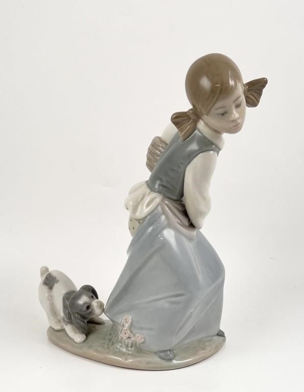 Appraisal: Retired Lladro porcelain figurine of a young girl with puppy