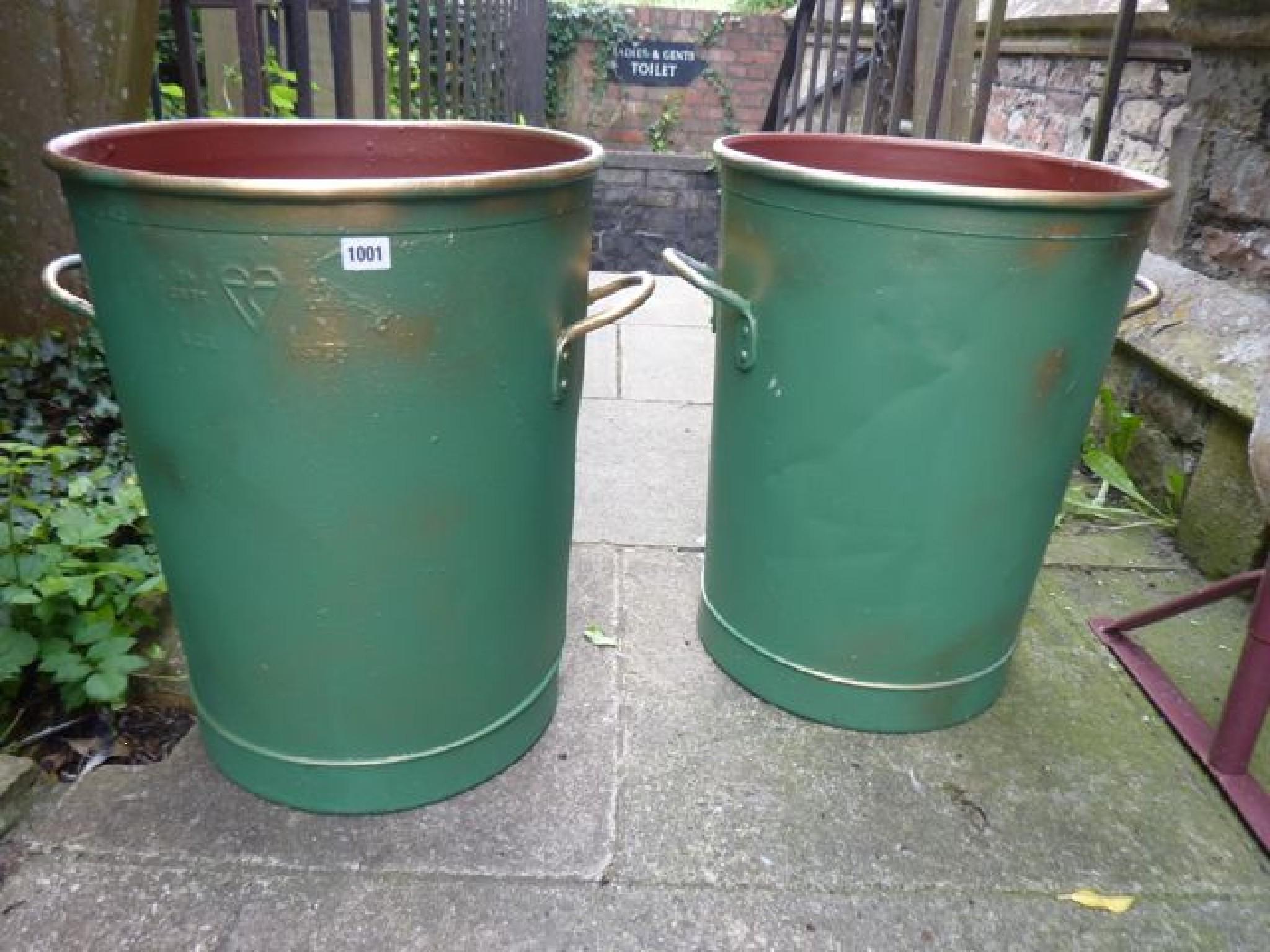 Appraisal: A pair of galvanised planters of cylindrical tapered form with