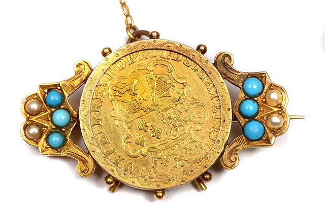 Appraisal: A GEORGIAN HALF GUINEA mounted as a pendant in Victorian