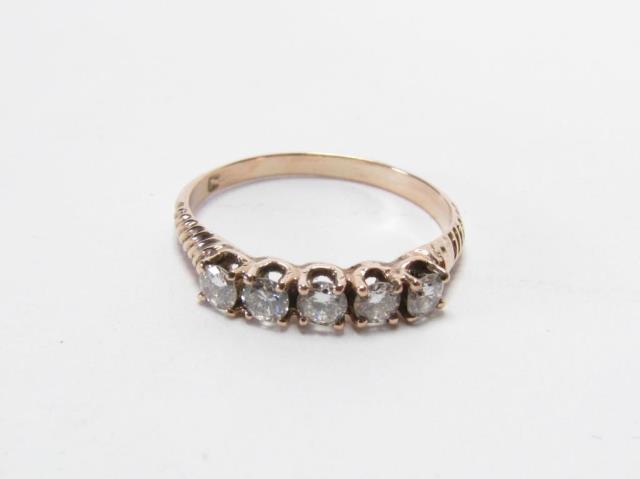 Appraisal: An antique yellow gold band with five ct diamonds size