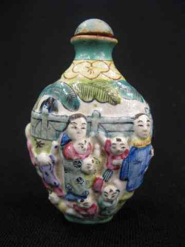 Appraisal: Chinese Porcelain Snuff Bottle raised figures signed '' excellent