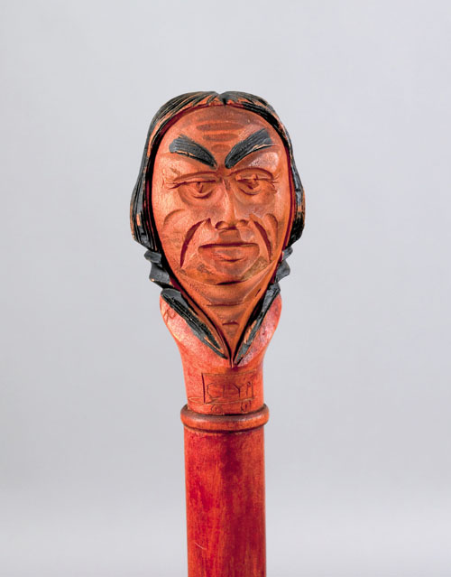 Appraisal: American carved cane with polychrome decorated Indian head grip and