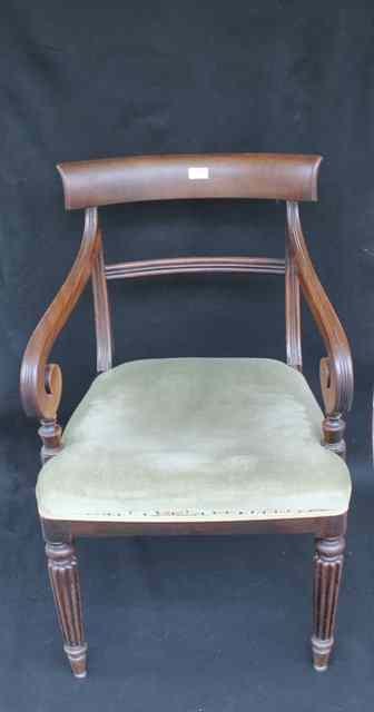 Appraisal: A REGENCY MAHOGANY CARVER CHAIR with spade back scrolled arms