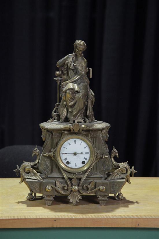 Appraisal: MANTLE CLOCK Ornate clock with woman playing flute finial and