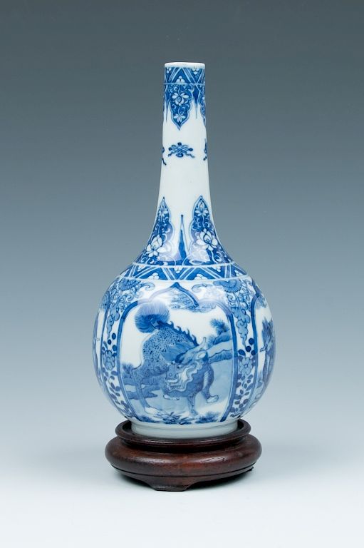 Appraisal: EXPORT BLUE AND WHIT E BOTTLE VASE QILING The body