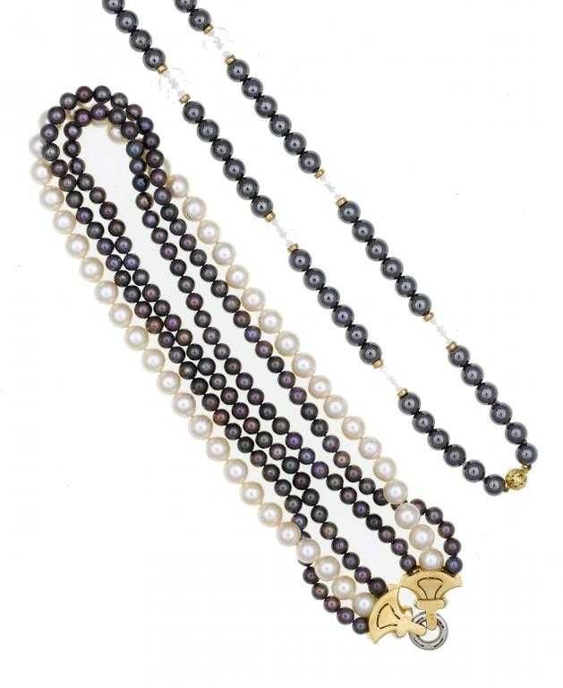 Appraisal: A CULTURED PEARL AND BLACK CULTURED PEARL THREE-STRAND NECKLACE with