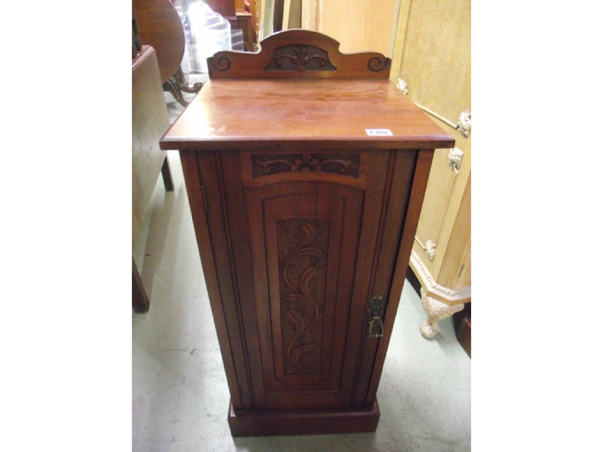 Appraisal: A late Victorian walnut bedside cupboard of square cut form