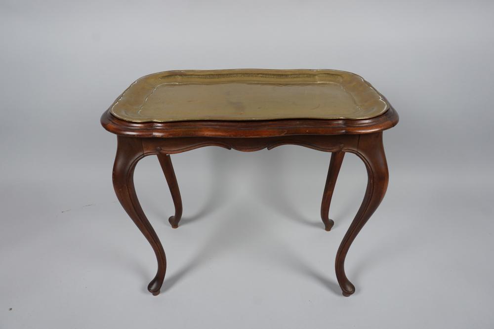 Appraisal: ROCOCO STYLE WALNUT STAINED AND BRASS TRAY TABLE the serpentine