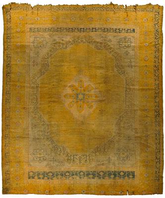 Appraisal: Oushak rug central medallion with geometric border faded gold and