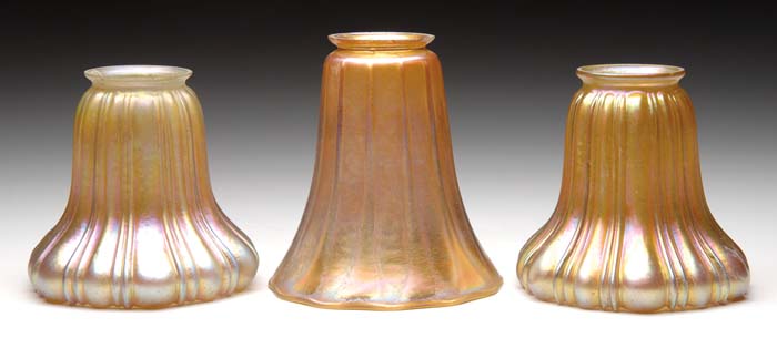 Appraisal: THREE ART GLASS SHADES Pair of vertically ribbed gold shades