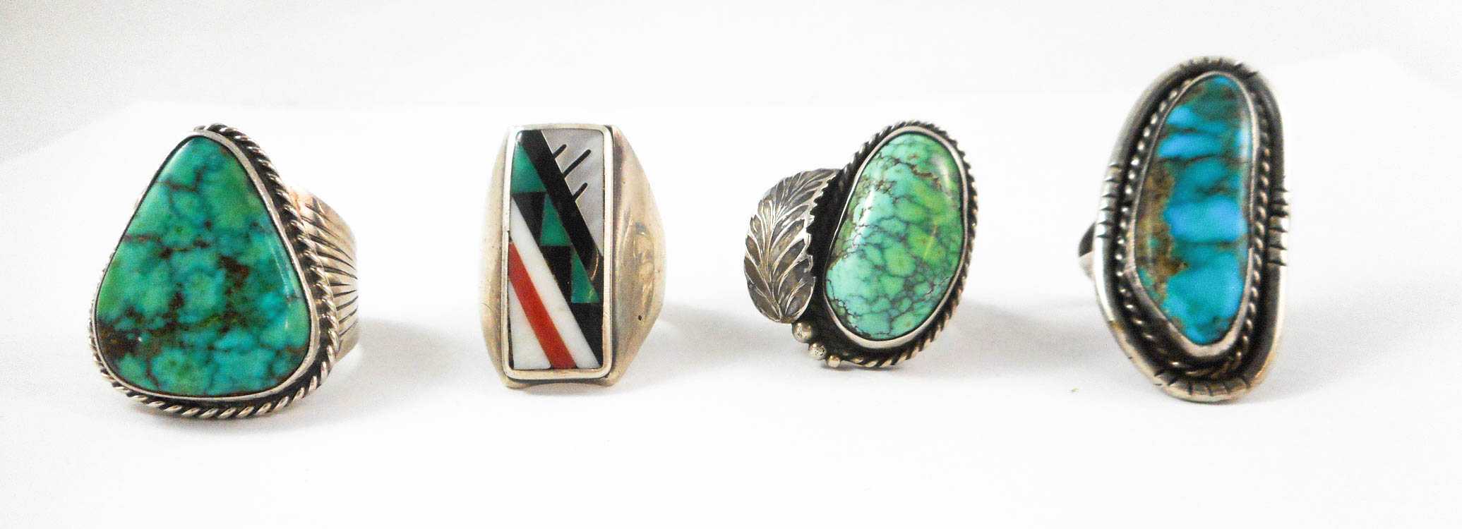 Appraisal: FOUR SOUTHWEST NATIVE AMERICAN SILVER RINGS the first with a