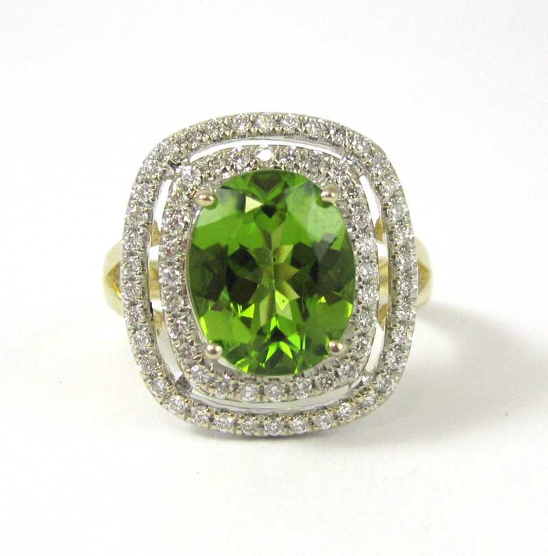 Appraisal: PERIDOT DIAMOND AND FOURTEEN KARAT GOLD RING The yellow and